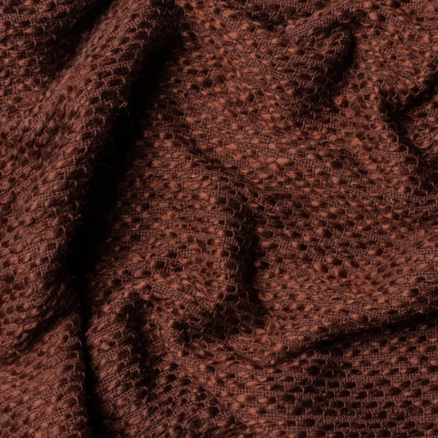 In muted earthy tones and solidly crafted from super soft, woven blends of yarn, the Morni throw instantly creates a warm, understated style for your soft furnishings. The design is complimented by tassel fringing on two sides and is ideal if you love to build up textures within a modern, neutral interior.