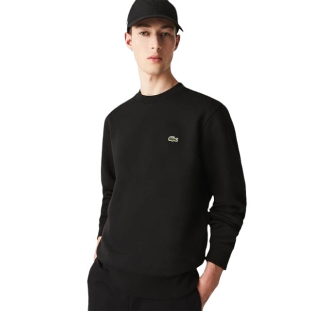 Stay warm and stylish in the Lacoste Fleece Crew Neck Sweatshirt. Made with brushed organic cotton fleece, this sweatshirt offers a soft and comfortable fit. The classic fit and high neck provide natural ease, while the signature crocodile embroidery adds a touch of sophistication. A bestseller from the sportswear experts since 1933.