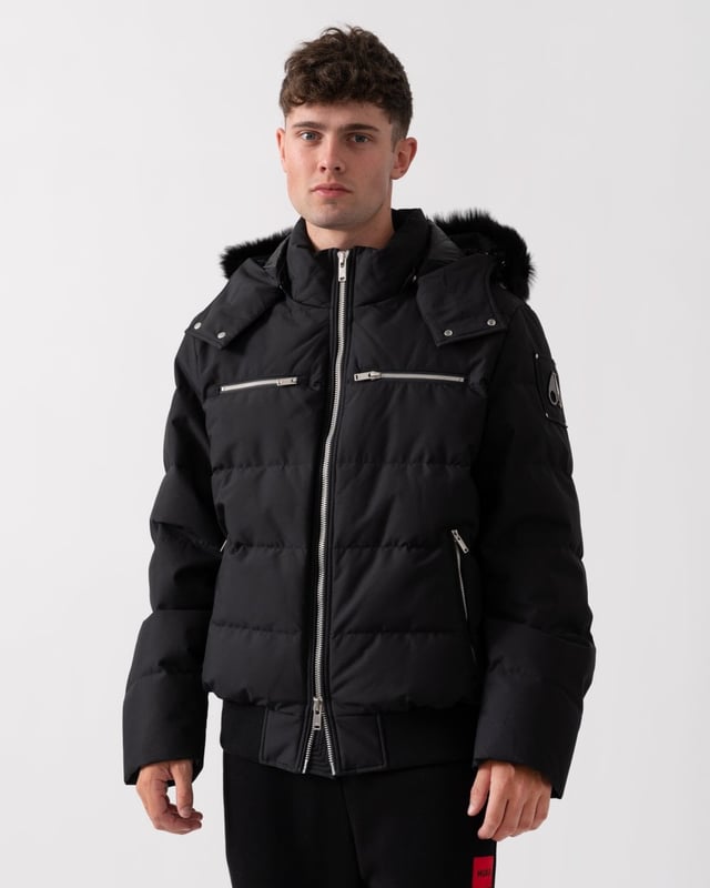 The Cloud Bomber boasts a 30% weight reduction compared to Moose Knuckles Originals, providing lasting warmth without added bulk. Crafted from lightweight shell and RDS-certified 90/10 down fill, it features a hollow frame logo for maximum warmth in a lightweight package. Its removable lamb shearling-trimmed hood adds versatility, while heat-retaining brushed pockets at the front enhance functionality.


Warmth & Protection


Protection Rating - Level 3: Crazy Cold – Heavy and durable, choose these garments when the cold gets serious.
800 Fill Power
Toscana Shearling on Trim
Water Repellent, Water Resistant, Wind Resistant




Design & Function


Capuchon amovible
Down Filled Collar
2- Way Zipper with Logo Puller
2 Pockets with Zipper Closure on Chest2 Pockets with Zipper Closure below Waist
Rib Knit Cuffs and Hem
Black Nickle Metal Logo


COMPOSITION



Body: 100% Polyester
Lining: 100% Polyester


FILL

90% Duck Down 10% Feathers
 
M34MB005S


 



 



 