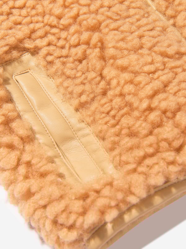 This sweet faux fur mini jacket from Stand Studio is perfect for little girls. Crafted from 100% polyester, it features a beige color and luxuriously soft fur. The cute design includes a snap front closure and side pockets for ultimate comfort and style. Perfect for a casual outing, it will keep little ones warm and looking cool.·  Stand Studio·  Occasion: Casual·  Plain