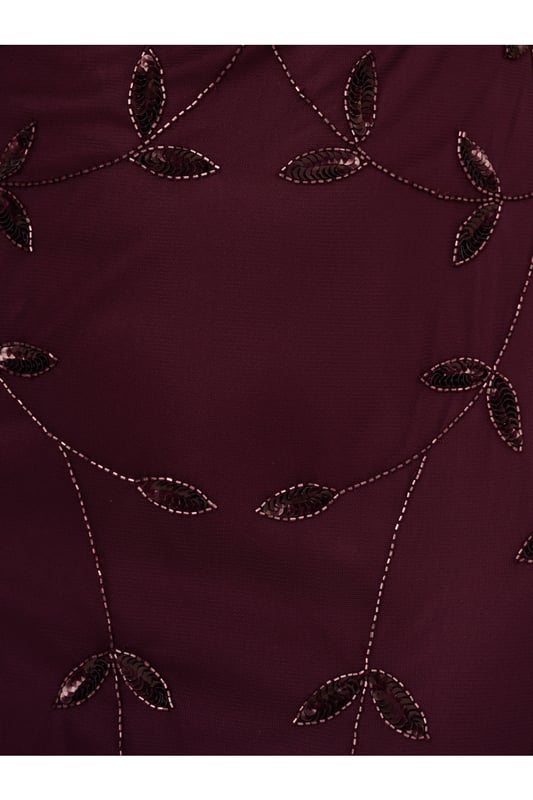 Put a little sparkle on display when you rock this sleeveless blouson gown. This formal dress features a sleeveless blouson bodice, deep v-neckline and back, and a soft skirt. Crafted with a luxe mesh fabric that is fully lined, this evening gown is embellished with sequin and beaded vines. The neckline and armholes of this gown are trimmed in beading for added sparkle. A hidden zipper closure at the centre back completes the design. This sleeveless beaded gown is a stunning look for a wedding guest or bridal party and pairs well with neutral or metallic accessories.