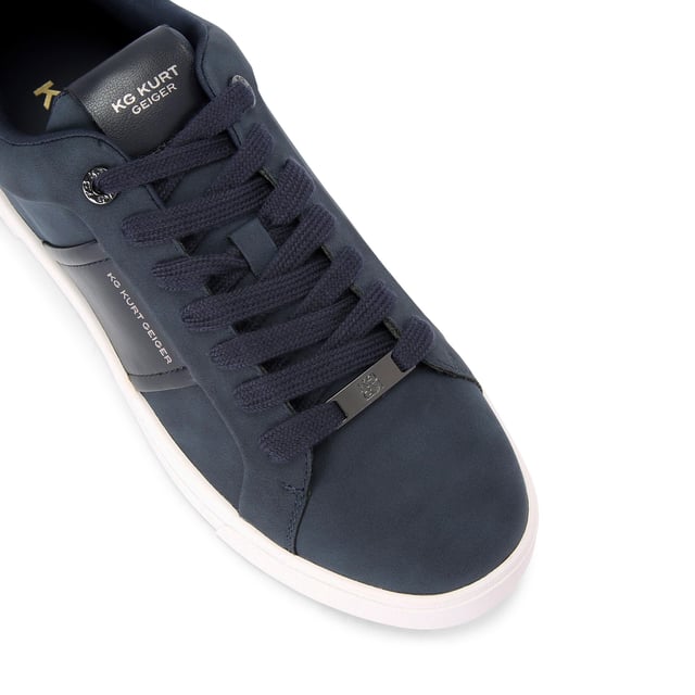 The Noah is a navy sneaker. The front laces up with black hardware across the shoe.