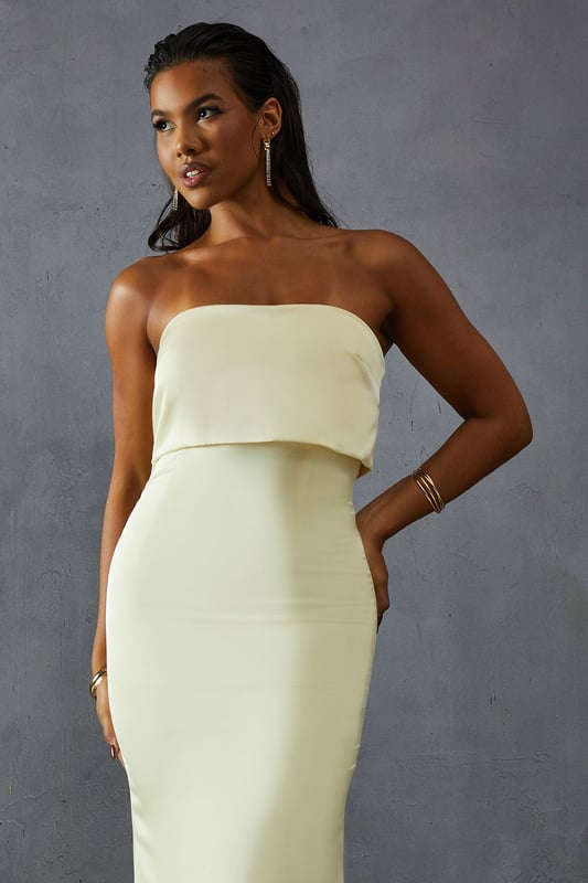 Elegant bandeau neckline with overlay detail
        Figure-hugging silhouette for a flattering fit
        Floor-length design perfect for formal occasions
        Luxurious satin fabric for a sophisticated look
        Sleek, strapless style to showcase your shoulders
    
    Make a striking entrance at your next formal event with this stunning bandeau overlay bridesmaid dress from MissPap. The sleek, strapless design features an elegant overlay detail that adds a touch of sophistication to the classic silhouette. The figure-hugging cut accentuates your curves, while the floor-length style ensures a dramatic sweep as you move. Perfect for weddings, galas, or any black-tie affair, this dress is versatile enough to be styled for various occasions. Pair it with strappy heels and statement earrings for a glamorous look, or opt for a delicate necklace and understated clutch for a more refined ensemble. The luxurious satin fabric catches the light beautifully, ensuring you'll shine throughout the evening. Whether you're a bridesmaid or a guest, this dress is sure to turn heads and make you feel like the belle of the ball.