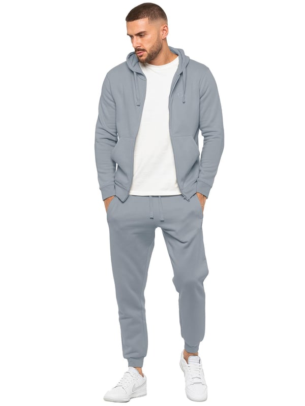 Experience ultimate comfort in our Enzo Mens Regular Fit Joggers. Made with a soft brushed back inner fleece lining, these joggers are perfect for casual wear. The cuffed leg design and elasticated waist with drawstrings provide the perfect fit. With 2 side slash pockets, you can easily carry your essentials.