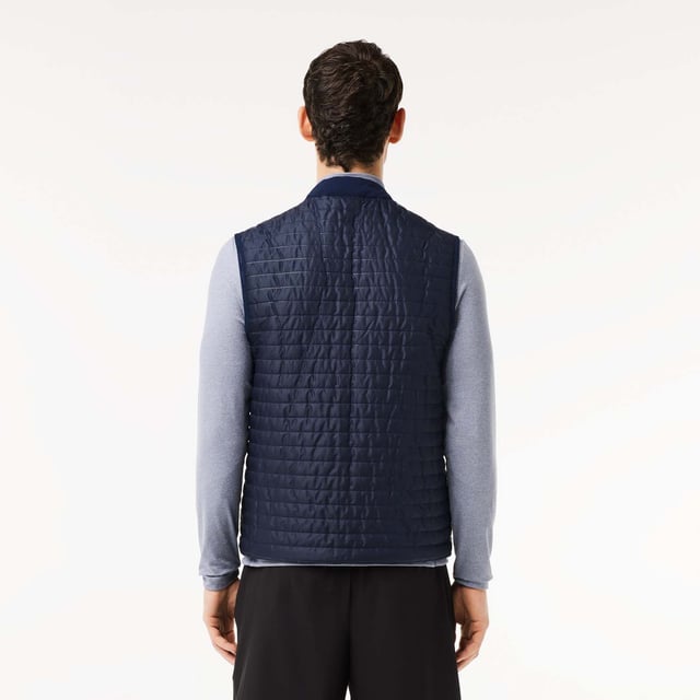 Designed for Tennis & Golf  for a regular frequency of use. This reversible padded sleeveless jacket is made with bonded quilting mixed with stretch taffetas on one side for an athletic silhouette and full bonded quilting for a more elegant look. This 3rd layer will keep you warm during your outdoor training. This product is providing you water repellent fabric which guarantees you to remain dry in bad weather conditions. Regular fit: natural ease on body It has been tested by professionals players to ensure functionality. The most adapted fashion sport apparel and accessories items to our Golf and Tennis athletes to prepare for and for game day.
