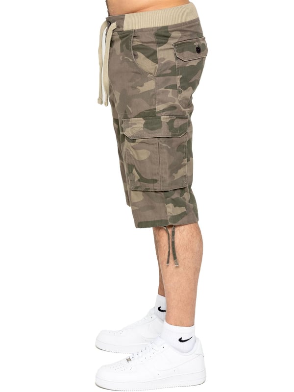 Effortlessly stylish and luxurious, Enzo offers Enzo Mens Camo Combat Cuffed Shorts with an elasticated waist featuring a drawcord and secured by a sophisticated button. These shorts are available in 3 elegant colours: Beige, Grey, and Vintage. The mid-rise design and ribbed waist add a touch of sophistication, while the 2 front pockets, 2 buttoned back pockets, and 2 velcro side pockets provide both function and fashion.