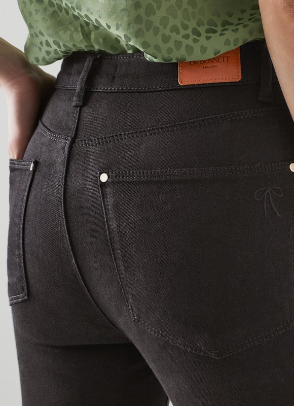 LK Bennett Graycen Trousers, Black Every denim collection needs a pair of classic black jeans, and our Graycen skinnies, crafted from super-soft black cotton, are the perfect example. Sitting comfortably on the waist, they have a button and zip fastening, belt loops, side and back pockets and a skinny cut. Wear them with a glittery knit and boots for a fun, seasonal look.
