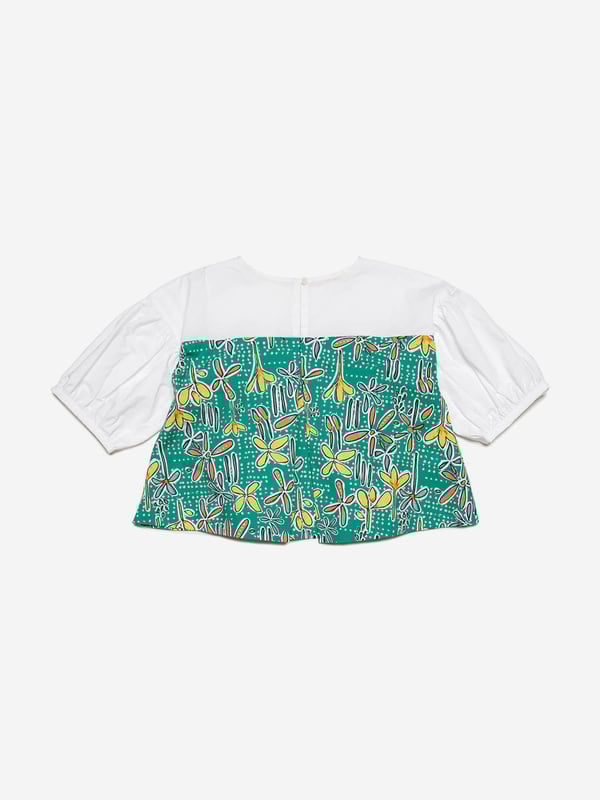 Marni's fresh invigorative perspective is embodied in this girls shirt. Inspired by the early noughties, it showcases poplin balloon sleeves with all-over Carioca graphics and a comfortable elastic. It is the perfect summer garment to be adored.   Button Closure On Back 100% Cotton