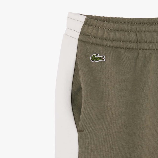 Kids’ Lacoste Organic Cotton and Recycled Polyester Track Pants Elasticated waistband Contrast bands Branding on side Embroidered crocodile Organic cotton flannel Kids’ Lacoste Organic Cotton and Recycled Polyester Track Pants Elasticated waistband Contrast bands Branding on side Embroidered crocodile Organic cotton flannel