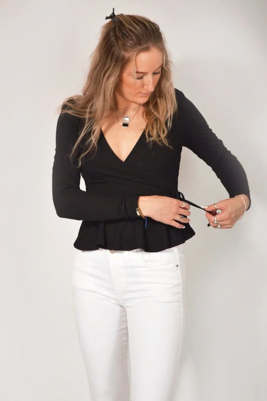 Wear day-to-night, this wrap top is the ultimate day to evening piece that never goes out of style. With an elegant gathered puff shoulder, fine rib detailing, this item will be a regular go to.  Sizing: As expected Length: 23" Shoulder to Hem
