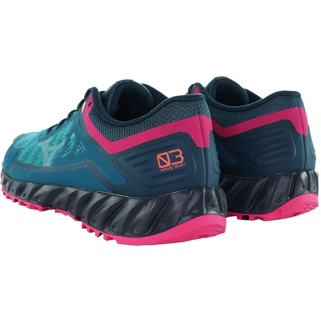 Mizuno Wave Ibuki 3 Trail Women's Blue Running Trainers, specifically designed to elevate your trail running experience. These trainers boast an array of features that provide both performance and style, making them a perfect choice for adventurous female runners:

 Trail-Ready Traction:  The outsole of the Mizuno Wave Ibuki 3 Trail trainers is engineered with aggressive lugs and durable rubber, providing exceptional traction on rugged terrains. Conquer challenging trails with confidence and stability.

 Wave Technology:  The midsole is equipped with Mizuno's signature Wave technology, offering excellent cushioning and shock absorption. This ensures a smooth and responsive ride, even on uneven surfaces.

 Protective Toe Cap:  The trainers feature a protective toe cap that shields your toes from rocks, roots, and other hazards encountered on the trail. Stay protected without sacrificing flexibility.

 Breathable Upper:  The breathable upper construction keeps your feet ventilated during long runs. It prevents overheating and moisture buildup, promoting a comfortable and dry feel throughout your adventure.

 Secure Fit:  The trainers incorporate a secure lacing system that allows you to adjust the fit according to your preferences. Enjoy a snug and customized fit that reduces movement inside the shoe.

 Stability and Support:  With a supportive design, the Mizuno Wave Ibuki 3 Trail trainers offer stability and control on challenging terrains. Maintain your balance and confidence as you navigate varying surfaces.

 Lightweight Design:  Despite their trail-ready features, these trainers remain lightweight, preventing unnecessary strain during extended runs.

 Stylish Look:  Combining performance with aesthetics, the blue colorway with subtle Mizuno branding ensures you look great while conquering the trails.