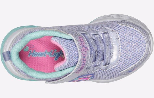 Brighten your steps with heart-filled style wearing Skechers Flutter Heart Lights Bring Sparkle. This lightweight slip-on features a lavender sparkle mesh upper and a fun 3-D heart-sculpted light-up midsole.
- Slip-on style in a stretch-laced front
- Cushioned midsole with 3-D sculpted light-up hearts
- Skechers logo detail