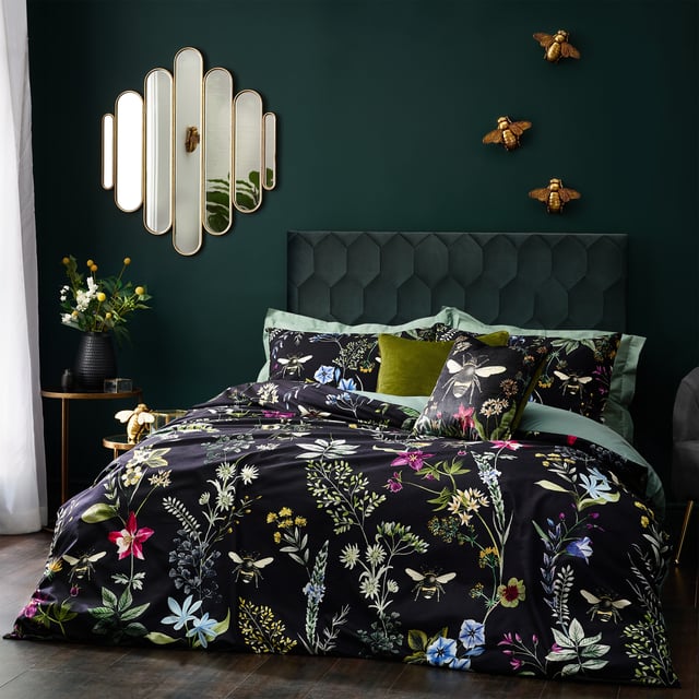 A striking digitally printed duvet set featuring an eye-catching contrast design, which will brighten up your bedroom in an instant, Busy bees hover among the bright, fresh florals of a meadow or garden, which are set on a contrasting luxuriously soft velvet jet black background. This exquisite set adds lovely pops of colour to your bedroom and gives it a natural feel too, helping you wake up in the morning and feel refreshed.