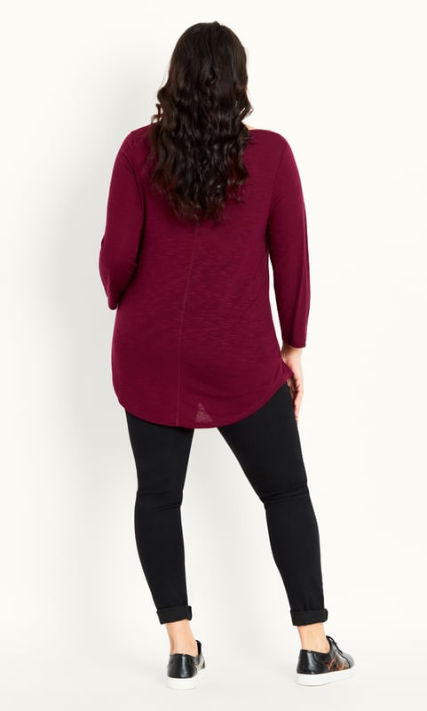 Opt for an elegant berry hue with our 3/4 Sleeve Slash Neck Top, offering a scoop neckline, 3/4 sleeves and soft stretch fabrication. Whether dressing down for a day at the shops or elevating your outfit for a dinner outing, this simple style can do it all! Key Features Include: - Scoop neckline - 3/4 sleeves - Relaxed fit - Soft stretch fabrication - Pull over style - Unlined - Hip length - Curved hemline Upstyle your evening look with leather look trousers, strappy stilettos and a chunky chain necklace.