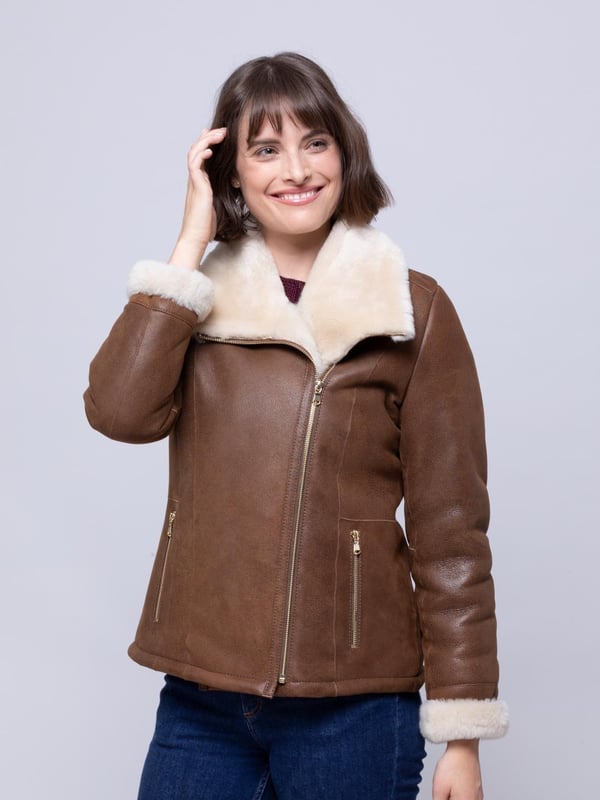 Allerdale Sheepskin Aviator Jacket in Caramel For those wanting to add a little extra glamour to their sheepskin aviator, the Allerdale offers just that. We've taken the classic style, in a rich-caramel hue, and added gold-toned hardware, to elevate the Allerdale. Hand-crafted from 100% sheepskin, this aviator has a nappalan finish, and in time it will develop a crackled vintage effect. Combined with a contrasting white wool, showcased on turn-back cuffs and a chunky collar, this is a distinctive jacket. The styling is incredible, yet nothing should take away from the sheepskin. After all these years it remains our favourite material, offering the perfect balance between form and function. As nature's ultimate insulator it's the first jacket you'll turn to when the temperatures drop. And, it will be with you for years to come.