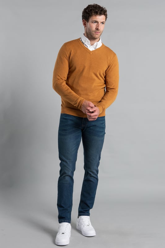 This V Neck jumper from Kensington Eastside is a season essential. Features long sleeves and ribbed elasticated neck, waistband and cuffs. Crafted from high-quality materials, this jumper is machine washable for easy care, making it both stylish and practical. Ideal for layering or wearing on its own, it's a versatile piece that complements any outfit.