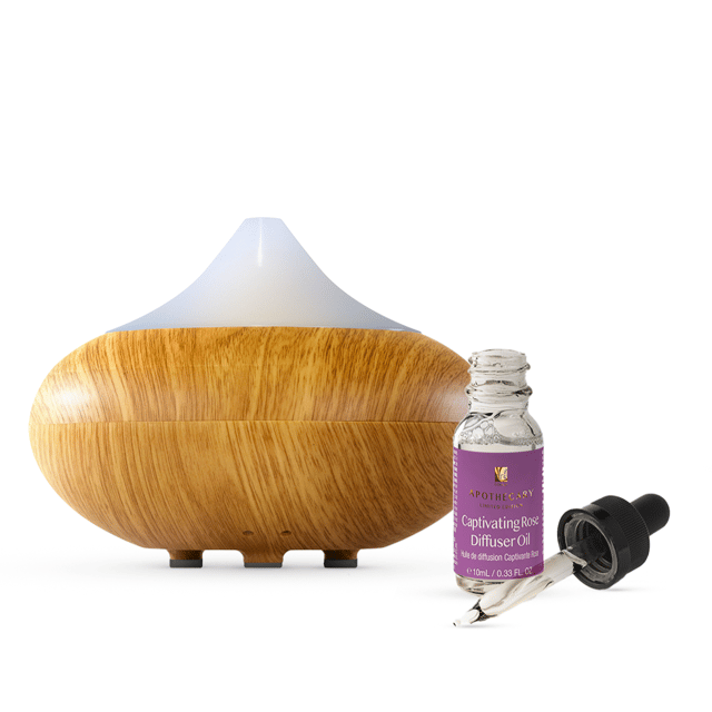 Immerse yourself in the allure of our Captivating Rose Diffuser Oil and Dr Botanicals Natural and Calming Wooden Aroma Diffuser Kit. Let the delicate fragrance of rose envelop your space, creating a harmonious ambiance that invokes love and tranquility. Paired with the advanced Dr Botanicals Diffuser, featuring changing light colors, mist modes, and fresh humidification, this kit seamlessly blends aromatherapy, light therapy, and air purification. Whether sparking romance or indulging in self-care, our Rose Diffuser Oil invites you to embrace moments of pure allure and relaxation with this perfect fusion of captivating scents and modern technology.