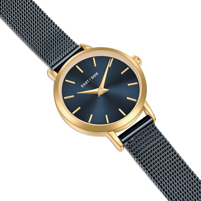 GENERAL INFORMATION:  • Targetgroup: Female  • Wristwatch: No Special Functions  • Display: analogue  • Weight of watch w/o box (gr.) - approx.: 24,0  MOVEMENT:  • Movement: Quartz  • Term of Movement: VC10  • Origin of movement: Japan  BRACELET:  • Material of bracelet/strap: Stainless steel  • Plating of bracelet/strap: Ion-Plating (IP)  • Finishing of bracelet/strap: Smooth  • Finishing/Decoration of bracelet/strap: None  • Clasp/Closure/Buckle: Slide Clasp  • Color of bracelet/strap: Blue  • Length of bracelet/strap (mm) approx.: 190,0  • Width of bracelet/strap (mm) approx.: 9,5  • Style/Design of bracelet/strap: Mesh band (Millanaise Style)  • Bracelet/strap adjustable?: No  CASE:  • Shape of case: Round  • Size/Diameter of case in mm . approx.: 24,0  • Height of case in mm: 7,6  • Case material: Metal (Alloy)  • Surface of case: Polished  • Bezel/Topring: Fixed  • Finishing/Decoration of case: None  • Material of case back: Stainless steel  • Lock of case back: No screwed-in crown  • Color of case: Yellowgold  • Coating/Plating (Case): Ion-Plating (IP)  • Type/Form of crystal: Flat  • Material of crystal: Mineral crystal  • Water resistant (ATM): 3  DIAL:  • Size jewelry care cloth: Hour, Minute  • Indices: Line indices  • Material of dial: Brass  • Structure/pattern of dial: Flat  • Color of dial: Blue  PUSHER, CROWN, HAND:  • Pusher: None  • Corrector: No  • Crown: No screwed-in crown  • Type of hands: Dauphine hands  • Luminescent (hands): No  PACKAGING & SCOPE OF DELIVERY:  • Box: Yes  • Service booklet: Yes  • Manual: Yes
