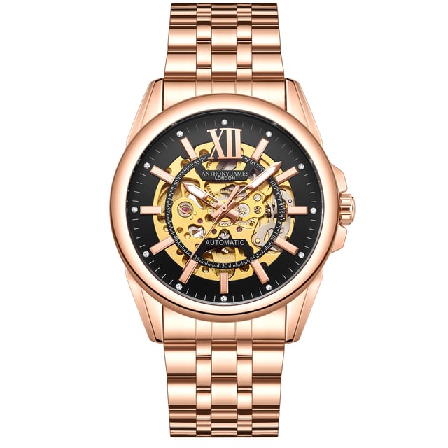 "Die Anthony James Hand Assembled Limited Edition Mystique Automatic Rose Herrenuhr verfügt über ein 21-Rubin-Uhrwerk mit 162 Teilen und eine hervorragende Präzision, die durch das skelettierte Goldzifferblatt hervorgehoben wird, das einen kühnen Kontrast zum schwarzen Rand bildet, und dieselbe Technik ist vom Gehäuseboden aus sichtbar. Die Uhr ist wasserdicht bis 3ATM und das kratzfeste Mineralglas ist anspruchsvoll und zuverlässig zugleich. Das rosafarbene Edelstahlarmband fixiert die Uhr, die mit einer fünfjährigen Garantie ausgestattet ist. " "Eigenschaften der Uhr - Automatikwerk - Handgefertigtes 162-teiliges Uhrwerk mit 21 Rubinen - Skelettiertes schwarzes und goldenes Zifferblatt - Wasserdicht 3ATM - Kratzfestes Mineralglas - 5 Jahre Garantie Maße und Gewichte - Gehäusedurchmesser 42 mm -. Dicke des Gehäuses 14 mm - Breite der Hörner 22 mm - Breite des Armbands 20 mm - Länge des Armbands 220 mm - Gewicht 123 Gramm Materialien und Farben - Stahl und Bo&amp;tier-Legierung - Skelettboden - Rosafarbenes Edelstahlarmband - Sicherheitsfaltschließe mit Logo - Krone mit Logo".