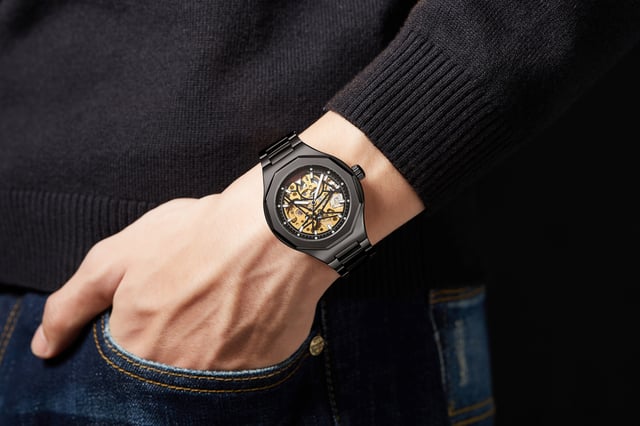 The Hand Assembled Anthony James Limited Edition Sports Skeleton Black men’s watch uses 162 part 21 jewel hand assembled movement that operates within the onyx Black IP geometric bezel secured by a Black IP bracelet. Its Skeleton Dial offers unique insight into the watch’s operation, while the scratch resistant mineral glass provides clarity. It boasts a 3ATM water resistance rating, and the Exhibition caseback completes the timepiece, which comes with a 5 year warranty.

Watch Specification
• Automatic Movement
• Hand Assembled 162 Part 21 Jewel Movement
• Black IP Geometric Bezel with Skeleton Dial
• Water Resistant 3ATM
• Scratch Resistant Mineral Glass
• 5 Year Warranty

Sizes & Weights
• Case Diameter 42 mm 
• Case Thickness 13.5 mm
• Lug Width 20 mm
• Strap Width 18 mm
• Strap Length 220 mm
• Weight 108 Grams

Materials & Colour
• Steel & Alloy Case 
• Skeleton Caseback
• Black IP Stainless Steel Bracelet
• Folding Safety Clasp with Logo
• Logo Crown