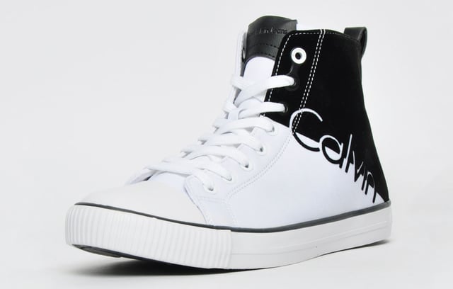 Calvin Klein Ajax Mens Calvin Klein can possibly be described as one of the most on-trend and exciting footwear brands around today <p>Feature a full front lace up system as well as a padded tongue and insole for the ultimate feel and comfort.</p> <p>These men's Hi Top trainers are constructed with premium materials with a unique black and white colour block design featuring a round toe with a rubber cap finished with Calvin Klein branding to the tongue side and heel providing an outstanding design with great brand awareness.</p> <p style='margin-left:36.0pt;text-indent:-18.0pt;mso-list:l0 level1 lfo1'>- Hi top design</p> <p style='margin-left:36.0pt;text-indent:-18.0pt;mso-list:l0 level1 lfo1'>- Lace front fastening</p> <p style='margin-left:36.0pt;text-indent:-18.0pt;mso-list:l0 level1 lfo1'>- Round toe with rubber cap</p> <p style='margin-left:36.0pt;text-indent:-18.0pt;mso-list:l0 level1 lfo1'>- Padded tongue</p> <p style='margin-left:36.0pt;text-indent:-18.0pt;mso-list:l0 level1 lfo1'>- Padded insole</p> <p style='margin-left:36.0pt;text-indent:-18.0pt;mso-list:l0 level1 lfo1'>- Textured outsole</p> <p style='margin-left:36.0pt;text-indent:-18.0pt;mso-list:l0 level1 lfo1'>- Calvin Klein branding throughout</p>