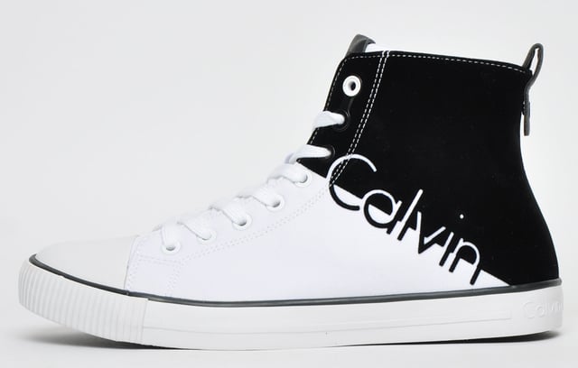 Calvin Klein Ajax Mens Calvin Klein can possibly be described as one of the most on-trend and exciting footwear brands around today <p>Feature a full front lace up system as well as a padded tongue and insole for the ultimate feel and comfort.</p> <p>These men's Hi Top trainers are constructed with premium materials with a unique black and white colour block design featuring a round toe with a rubber cap finished with Calvin Klein branding to the tongue side and heel providing an outstanding design with great brand awareness.</p> <p style='margin-left:36.0pt;text-indent:-18.0pt;mso-list:l0 level1 lfo1'>- Hi top design</p> <p style='margin-left:36.0pt;text-indent:-18.0pt;mso-list:l0 level1 lfo1'>- Lace front fastening</p> <p style='margin-left:36.0pt;text-indent:-18.0pt;mso-list:l0 level1 lfo1'>- Round toe with rubber cap</p> <p style='margin-left:36.0pt;text-indent:-18.0pt;mso-list:l0 level1 lfo1'>- Padded tongue</p> <p style='margin-left:36.0pt;text-indent:-18.0pt;mso-list:l0 level1 lfo1'>- Padded insole</p> <p style='margin-left:36.0pt;text-indent:-18.0pt;mso-list:l0 level1 lfo1'>- Textured outsole</p> <p style='margin-left:36.0pt;text-indent:-18.0pt;mso-list:l0 level1 lfo1'>- Calvin Klein branding throughout</p>