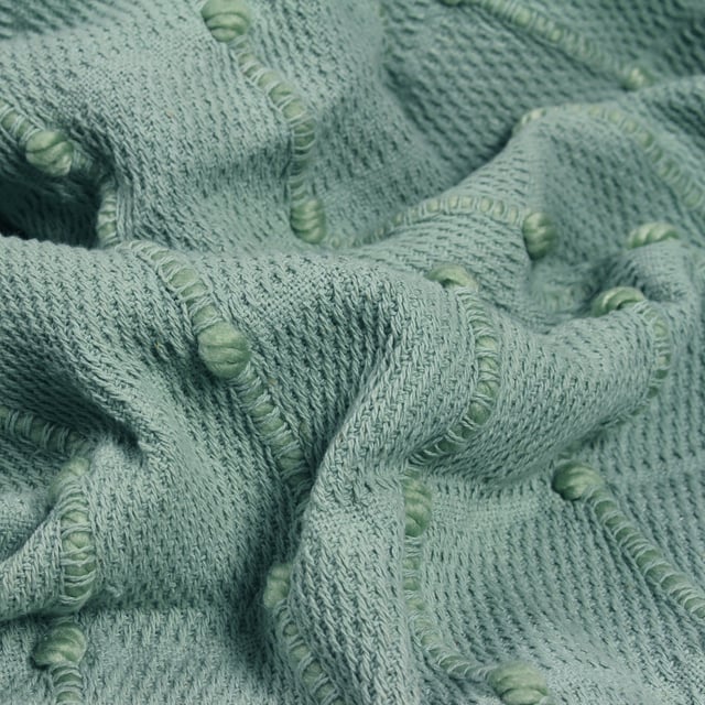 For cosy evenings, our Motti cotton throw is a perfect choice. Featuring woven recycled PET yarn detail, for added texture, and finished with tassel fringe on two sides. Style and layer on a bed for a laid back look, or for cool summer evenings outside.