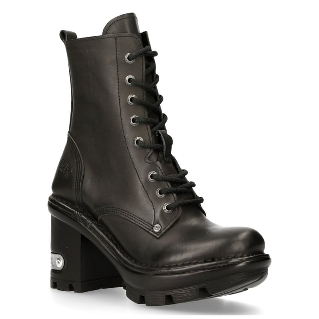 New Rock has paired the classic ankle boot with a high heel that results in a unique and trendy take on the military and biker style shoe. The upper on this shoe is crafted from genuine cow hide and features an 8-eyelet lace fastening and intricately stitched leather panelling to create a smooth and slick finish. The heel measures at 9cm and imbues a bold character onto this boot and features a metallic New Rock logo which has been implemented to stand out against the black design of the shoe. • Heel Height - 9cm• Platform Height - 3cm• Shaft Height - 15cm• Calf Width- 25cm• Outer Material - Cow Hide Leather