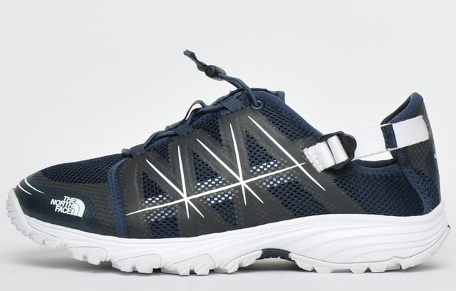 These North Face Litewave Amphibious shoes are designed to withstand the demands of hiking in wet environments <p>Constructed from a non-wicking synthetic and airmesh upper with a collapsible and adjustable heel counter this shoe is a reliable partner for your favourite outdoor adventures. </p> <p>A moulded EVA Northotic footbed cushions your feet across rocky riverbeds and other tough terrains, while the high-abrasion UltrATAC rubber outsole provides maximum grip on wet and slippery surfaces.</p> <p>- Textile mesh and synthetic mix upper</p> <p>- Personalised bungee lace system</p> <p>- Collapsible and adjustable heel counter </p> <p>- Moulded EVA Northotic footbed-</p> <p>- UltrATAC rubber outsole</p> <p>- North Face branding</p>