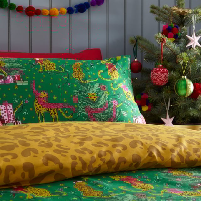 Bring some playful festive cheer to your bedroom this holiday season, with the Purrfect Christmas Duvet Cover Set. Featuring Leopards getting into mischief wrapped in tinsel, and opening presents under the tree. This bold print is complete with a tonal leopard print reverse, giving you two looks in one!