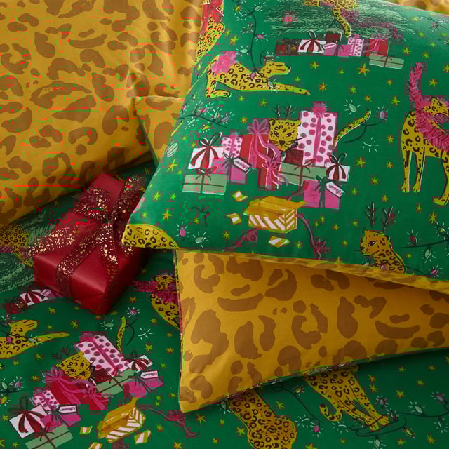 Bring some playful festive cheer to your bedroom this holiday season, with the Purrfect Christmas Duvet Cover Set. Featuring Leopards getting into mischief wrapped in tinsel, and opening presents under the tree. This bold print is complete with a tonal leopard print reverse, giving you two looks in one!