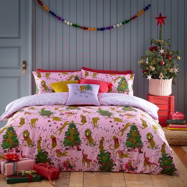 Bring some playful festive cheer to your bedroom this holiday season, with the Purrfect Christmas Duvet Cover Set. Featuring Leopards getting into mischief wrapped in tinsel, and opening presents under the tree. This bold print is complete with a tonal leopard print reverse, giving you two looks in one!