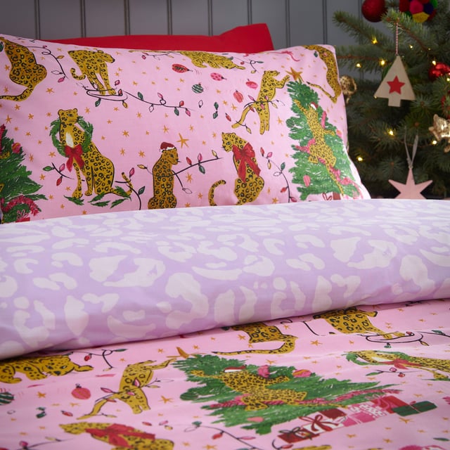 Bring some playful festive cheer to your bedroom this holiday season, with the Purrfect Christmas Duvet Cover Set. Featuring Leopards getting into mischief wrapped in tinsel, and opening presents under the tree. This bold print is complete with a tonal leopard print reverse, giving you two looks in one!