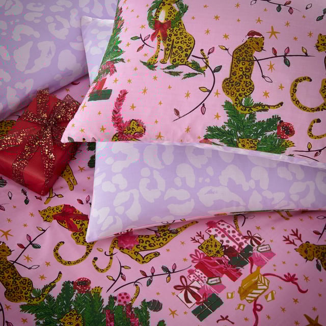 Bring some playful festive cheer to your bedroom this holiday season, with the Purrfect Christmas Duvet Cover Set. Featuring Leopards getting into mischief wrapped in tinsel, and opening presents under the tree. This bold print is complete with a tonal leopard print reverse, giving you two looks in one!