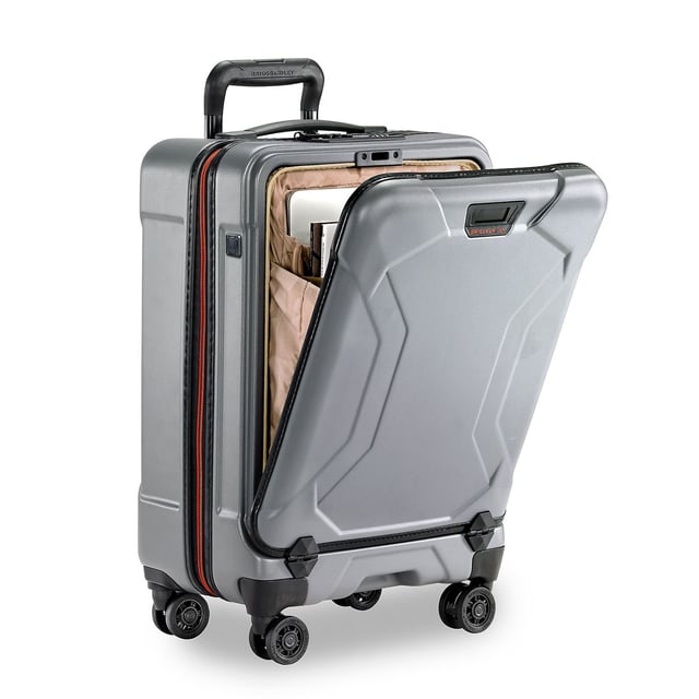 Stop fumbling with zippers and cords and switch to our Torq Domestic Carry-On Spinner. With a USB port and patented hinged front pocket, this bag will be your go-to for all destinations. Lightweight and resilient, take it with you to the city or the beach -- wherever you roam. Key features include: Outsider® handle provides greater interior capacity and a smooth surface for packing so clothes arrive wrinkle-free. Monogrammable leather nameplate to customise with your initials; easily removable and replaceable. External USB port on side of bag connects to a separate battery stored in front pocket, conveniently letting you charge your phone or other device from outside the bag. Integrated padded laptop sleeve in front compartment protects most 15" laptops. Padded tablet slip pocket in front compartment protects most 10.5" tablets.