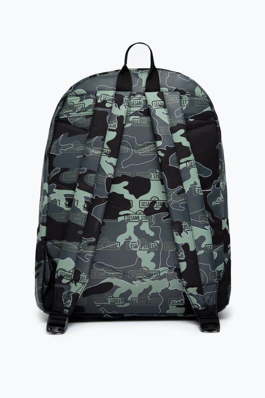 The Hype x Sesame Street Grey Logo Camo Backpack features our signature camo in charcoal, grey and black with the Sesame Street logo on repeat. The front pocket features a reflective fabric for a contrasting look. With a front pocket, puller handle and straps measuring at 42 cms x 30 cms x 12cms, this is the perfect size to transport your essentials. The straps contain the comfort you require with just the right amount of padding. Finished with the iconic HYPE. crest badge in monochrome. Wipe clean only.