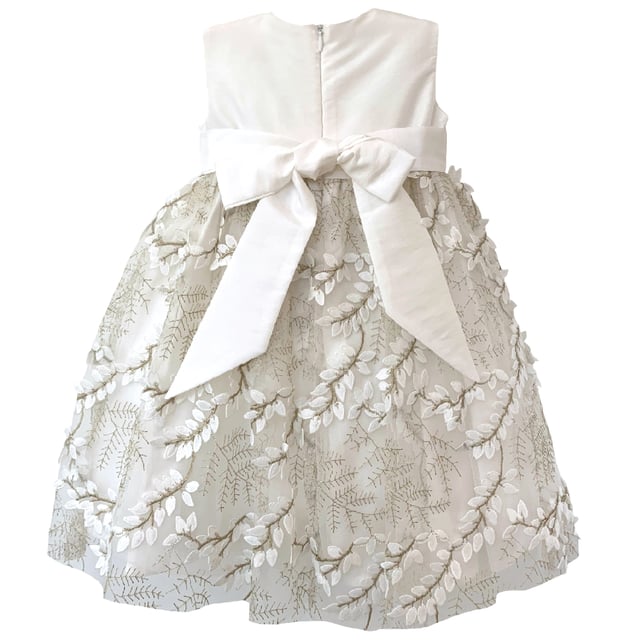 Another new style for us this year. We are so excited to have sourced the beautiful fabric for this style LUCY.

Fern style embroidered leaves in ivory, attached by gold thread stems. The gold catches in the light as the skirt moves and has a 3D effect which makes the leaves look realistic. A very distinctive fabric makes this girls special occasion dress quite unique. You won't see another dress like this on the high street!

The top of the dress is made using our 'Mock Silk' fabric and has a pin tucked sash that ties at the back in a big bow. It's fully lined in lightweight soft 100% cotton, just in case your little one has sentitive skin and also helps them not to get too sweaty after all the twirling and pirouetting around. Let's be honest ... all girls will feel like a princess in this!

All our dresses arrive with you on a satin padded hanger to help keep the dress in the best shape and then protected by one of our heritage garment keepsake bags
Outer - 100% Polyester
Lining - 100% Cotton
Dry Clean or Hand Wash only