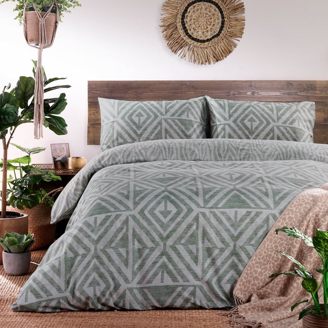 A soft, global-inspired geometric print - perfect for adding texture and warmth to your bedroom. Featuring a tonal animal print reverse print, for a softer alternative when you need it.