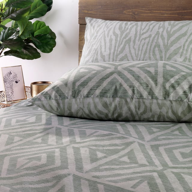 A soft, global-inspired geometric print - perfect for adding texture and warmth to your bedroom. Featuring a tonal animal print reverse print, for a softer alternative when you need it.