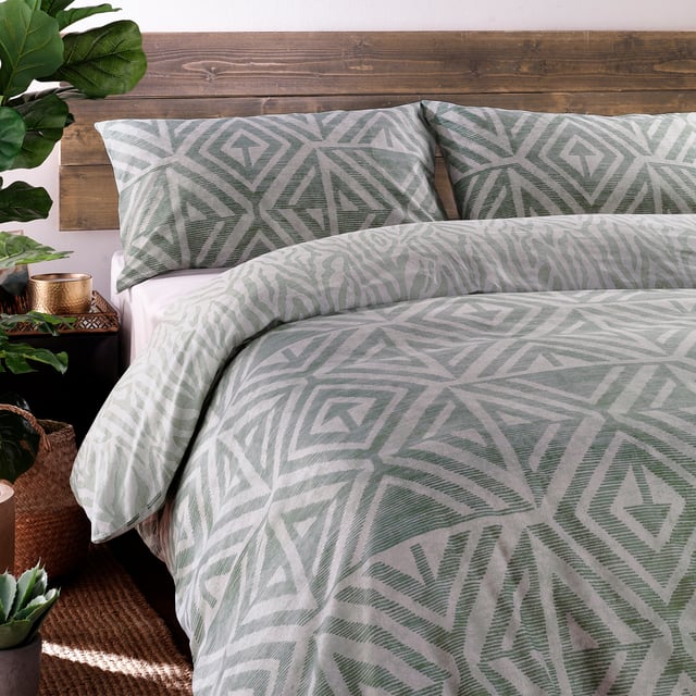 A soft, global-inspired geometric print - perfect for adding texture and warmth to your bedroom. Featuring a tonal animal print reverse print, for a softer alternative when you need it.