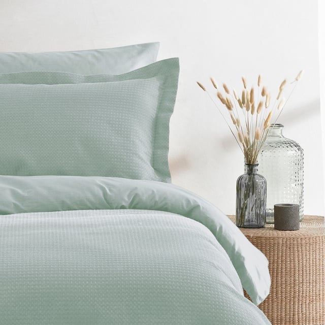 The Waffle duvet set is made of 100% soft cotton, woven on a loom making it a very durable fabric. It’s unique three dimensional design gives it a large surface area to keep you snug and warm on cold evenings while also being breathable for warmer weather. This full bodied duvet set comes with large matching pillowcases complete with an oxford border for that extra touch of luxury. The duvet cover set has a secure button closure while the pillowcases feature a simple envelope closure to keep your pillow safely in place. For the best finish machine wash at 40 degrees. Tumble dry on a low setting and use a hot iron.
