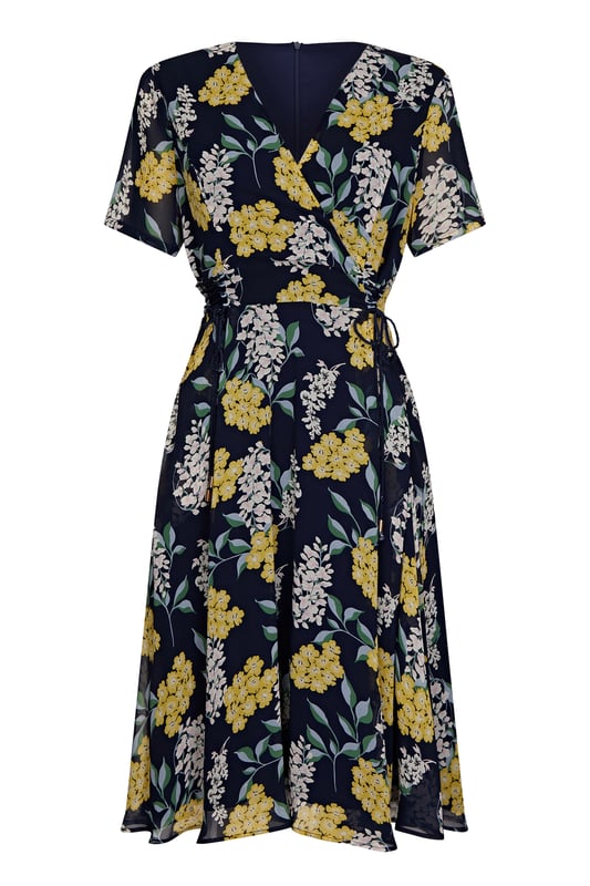 Find your new floral with this must-have Spring Floral Dress With Tie Detail. In the faux-wrap shape that cinches at the waist, it's enhanced by a drawstring that's super-swish and flattering. Our designers have kept the V-neckline elegantly modest, whilst making sure the print is both bright and feminine. Dress it up with wedges and down with trainers. Shell:100% Polyester, Lining:97% Polyester 3% Elastane. Machine Wash At 30. Length 106cm. Model Wears Size 10.
