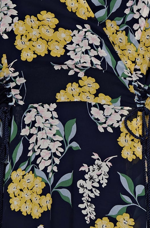Find your new floral with this must-have Spring Floral Dress With Tie Detail. In the faux-wrap shape that cinches at the waist, it's enhanced by a drawstring that's super-swish and flattering. Our designers have kept the V-neckline elegantly modest, whilst making sure the print is both bright and feminine. Dress it up with wedges and down with trainers. Shell:100% Polyester, Lining:97% Polyester 3% Elastane. Machine Wash At 30. Length 106cm. Model Wears Size 10.