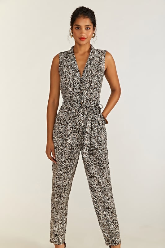 Meet the perfect one-piece: our Leopard Print Jumpsuit. On-trend and with a fierce twist, this sleeveless jumpsuit is cut from lightweight and smooth polyester. The semi-fitted cut allows the fabric to gather at the waist, secure with a tie and drape from the hips down. With pockets adding practicality, the animal print design is something to go wild for. 95% Polyester 5% Elastane. Machine Wash At 30. Length is 148cm/58inches.