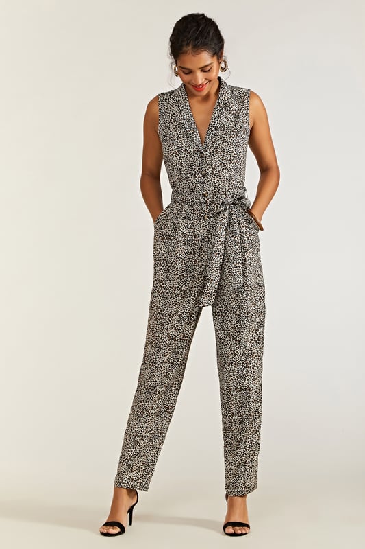Meet the perfect one-piece: our Leopard Print Jumpsuit. On-trend and with a fierce twist, this sleeveless jumpsuit is cut from lightweight and smooth polyester. The semi-fitted cut allows the fabric to gather at the waist, secure with a tie and drape from the hips down. With pockets adding practicality, the animal print design is something to go wild for. 95% Polyester 5% Elastane. Machine Wash At 30. Length is 148cm/58inches.