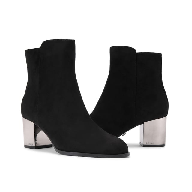 This Royale Ankle boot features a black microsuede upper with statement silver block heel.
