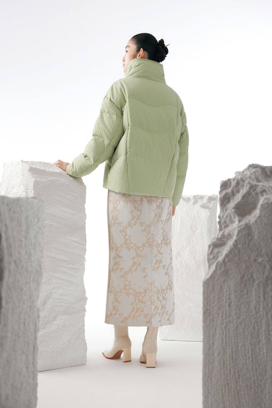 Experience ultimate warmth with our luxurious 700+ fill goose down, offering ultra-light insulation of exceptional quality. With 90% premium pure goose down and flawless distribution to prevent leakage, you’ll enjoy long-lasting, optimal insulation.

CHINESE JACQUARD FABRIC: A special design that blends the traditional with the modern.

LAPEL COLLAR: Our wider design creates a sophisticated look.

MOUNTAIN COLOUR: The uplifting palette of the mountains in a patchwork effect.

LUXURIOUS 700+ FILL GOOSE DOWN: Ultra-light insulation of exceptional quality.
