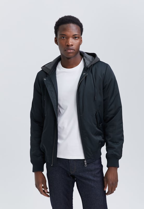 This navy bomber has removable grey hood and zip and button fastening.