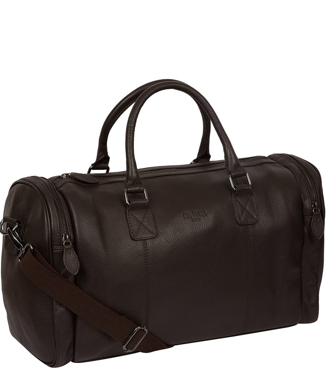 Crafted from natural leather with a supple and ultra-soft feel, the 'Ocean' holdall from Cultured London is the perfect bag for a when travel is on the agenda. The zip-over top secures the main compartment, concealing the 100% natural cotton lining. Two outer zipped pockets provide extra storage solutions, complemented by metal fittings. Comes with matching leather grab handles and an adjustable strap with a drop length of 70cm. Finished with the contemporary embossed Cultured London logo.