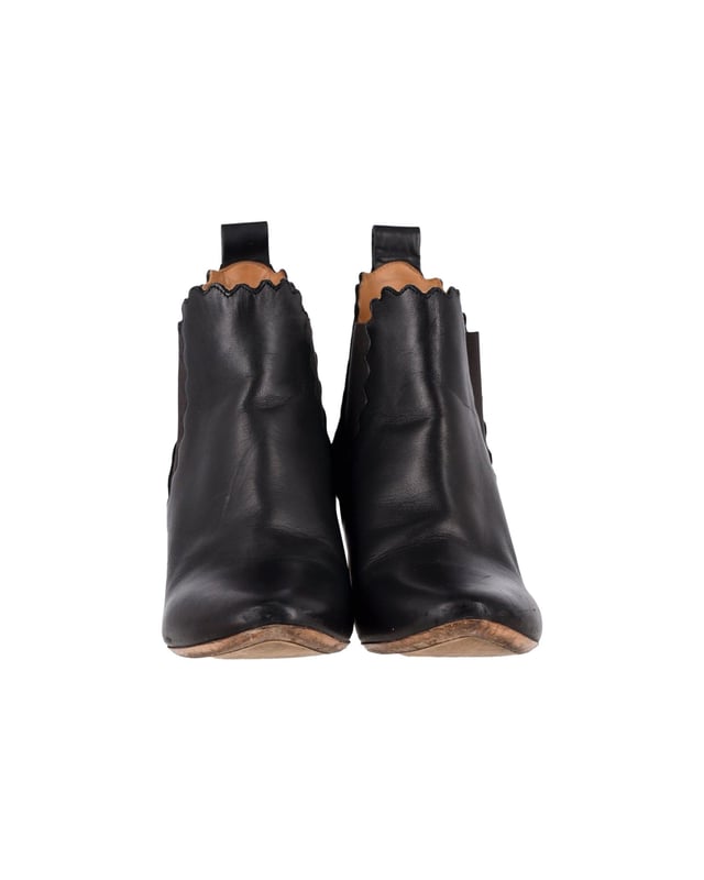 VINTAGE, RRP AS NEW
A blend of style and bold simplicity, these ankle boots from Chloé will sweetly complement your casual as well as evening ensemble. Crafted with black leather, the boots are characterized by the interesting scalloped detail adorning the elasticated panels and the top line. They are styled with covered block heels and round toes. Team these feminine boots with your skirts or fitted jeans.
Chloé Scalloped Chelsea Boots in Black Leather
Condition: good
Sign of wear: slight leather creasing and soles have scuffs & wear
SKU: 336646   
Color: black
Material: Leather
Size: EU39.5